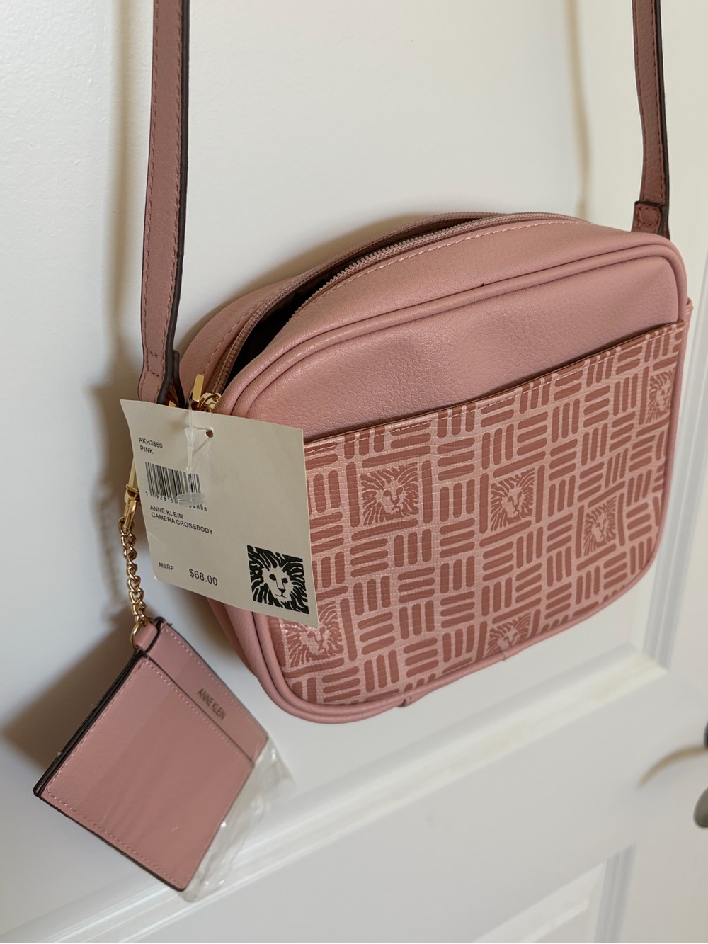 Anne Klein pink crossbody bag with a matching detachable card pouch